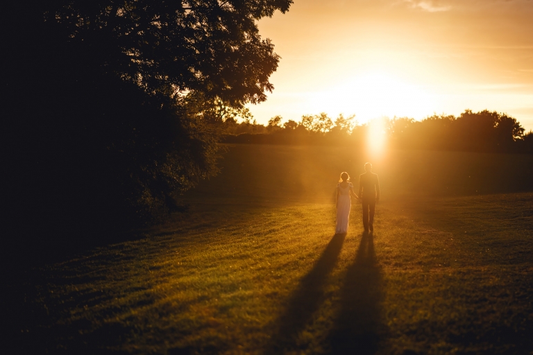 golden hour silohette of bride and groom