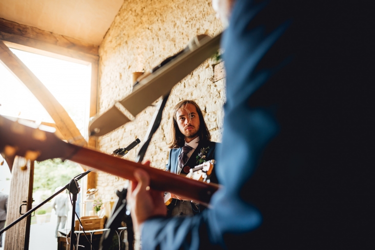creative documentary wedding photo of guitarist