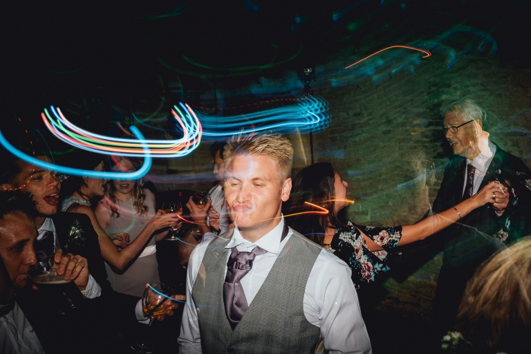 groomsman pouting on dancefloor