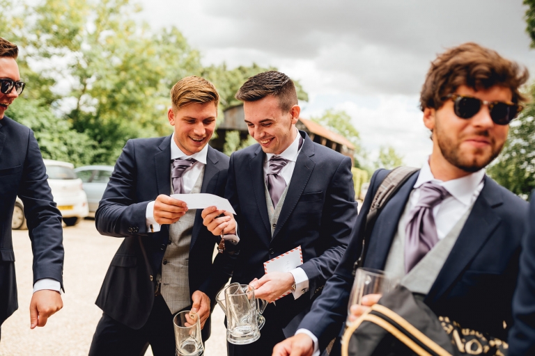 groomsmen all laughing before ceremony in cirencester