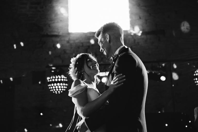 the bride and groom having thier first dance