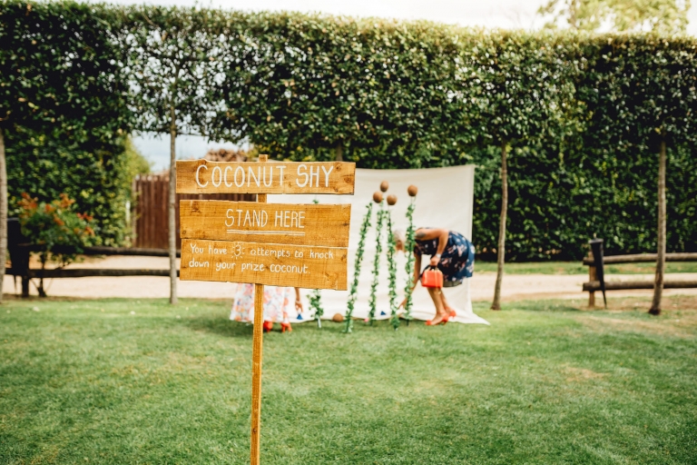 coconut shy in the garden at Cripps Barn wedding venue