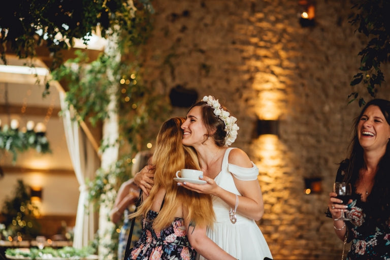 bride hugging a guest