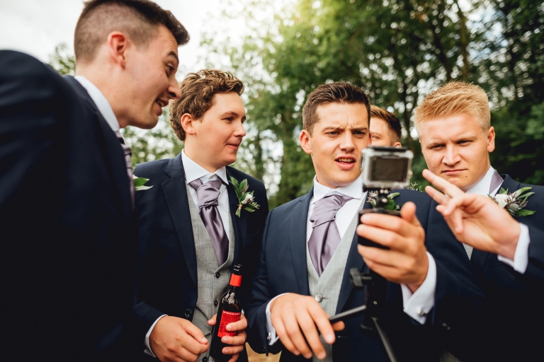 groomsman looking at go pro